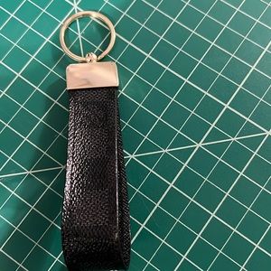 Authentic Louis Vuitton leather repurposed into a keychain.